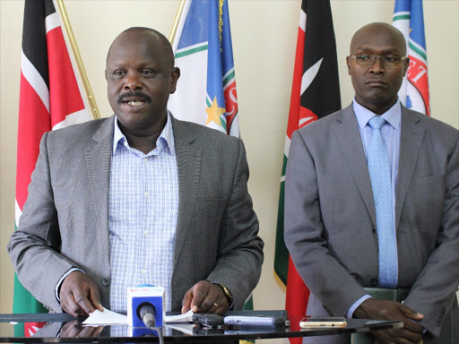 Bomet Governor Isaac Ruto flanked by acting county Secretary Kilelson Mutai during a press briefing at the county headquarters at which he announced reshuffled, March 30, 2016. Photo/FELIX KIPEMOI