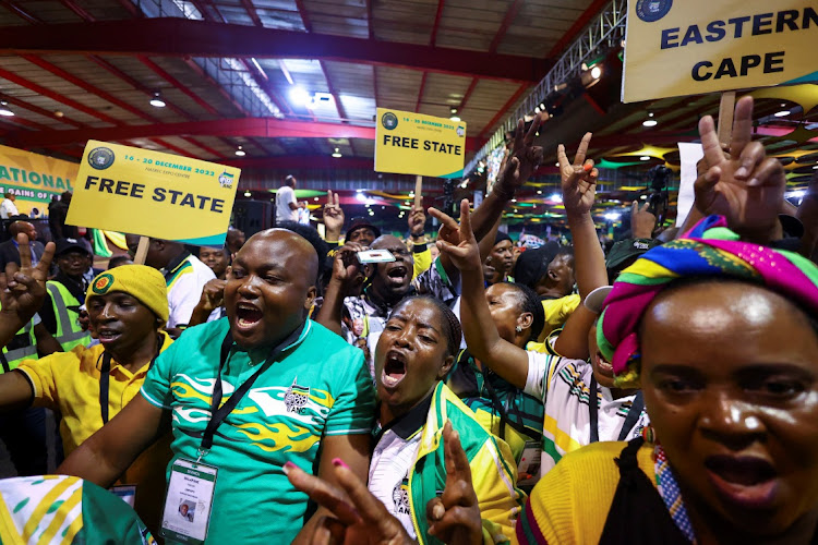 Delegates react to the top 7 announcement at the ANC national elective conference at Nasrec in Johannesburg on December 19 2022.