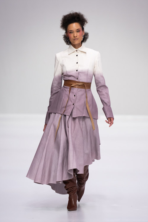 Belts are a girl's best friend. A model on the runway for Munkus at SA Fashion Week.