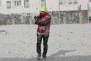 The cold front brought gale force winds, rough seas and sea foam, which happens when large blooms of algae decay offshore and are agitated by wind and waves, to the shores of Sea Point promenade in Cape Town on July 13 2020. 