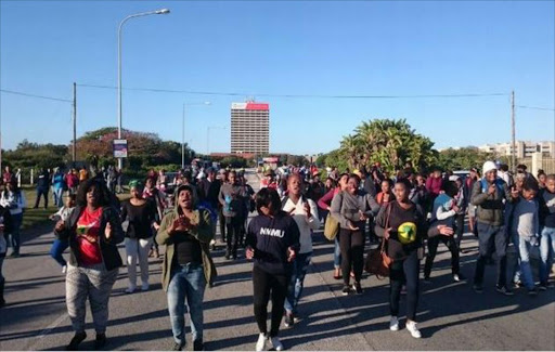 A group of about 60 students protested outside the Port Elizabeth Magistrate’s Court