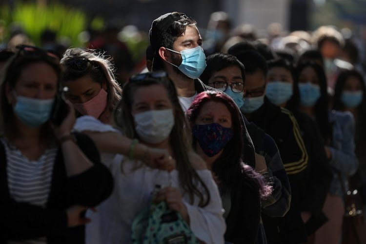 People wait in line outside a coronavirus disease (COVID-19) vaccination centre at Sydney Olympic Park. Picture: LOREN ELLIOTT/REUTERS