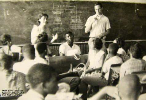 Two Freedom Summer volunteers teaching children in Freedom School