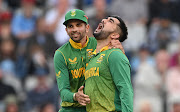 South Africa spinner Keshav Maharaj (L) is confident that counterpart Tabraiz Shamsi (R) will soon find form.