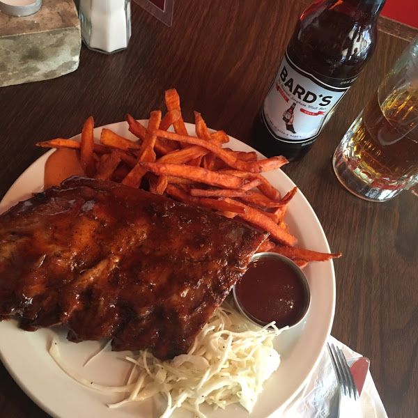 Half of rack with sweet potato fries and a bards gf beer