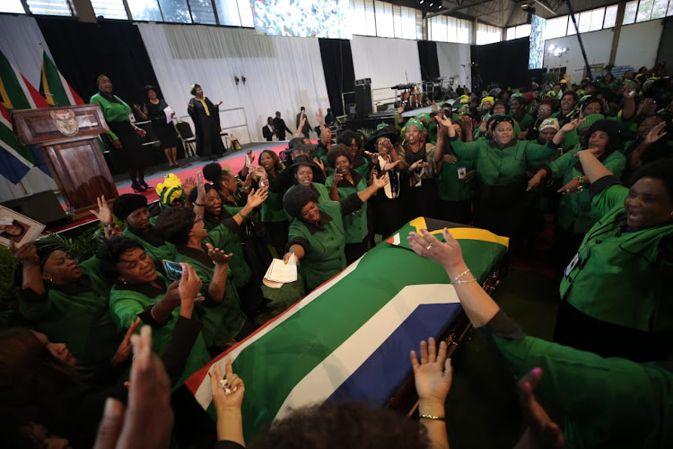 Members of the ANC Woman's league sing struggle songs around the coffin of former minister of environmental affairs, Edna Molewa at her funeral in Pretoria on October 6 2018