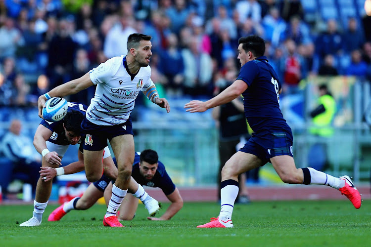 Braam Steyn of Italy attempts to evade Sam Johnson of Scotland during the Six Nations match at Stadio Olimpico in Rome, on February 22, 2020.