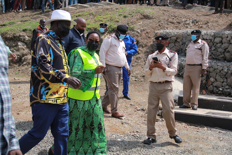 Opposition leader Raila Odinga and CS Secily Kairiuki during opening of Homa Bay water project in Hoka Bay town on January21,2022