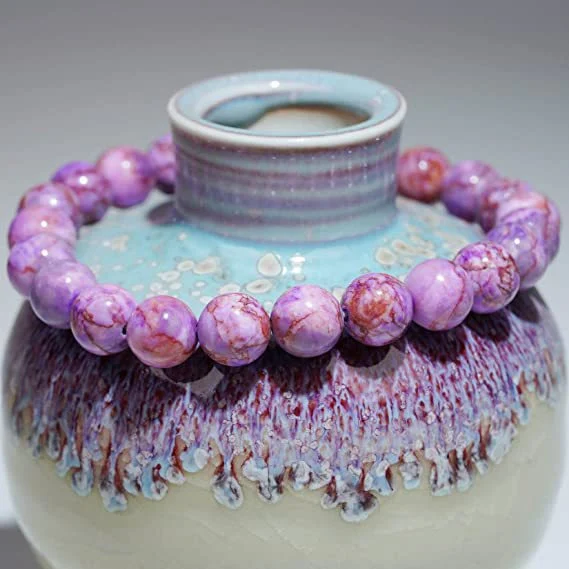 Handgemaakte elastische armband met natuurlijke tijgeroog en turkoois kralen. Bescherming en stijl.