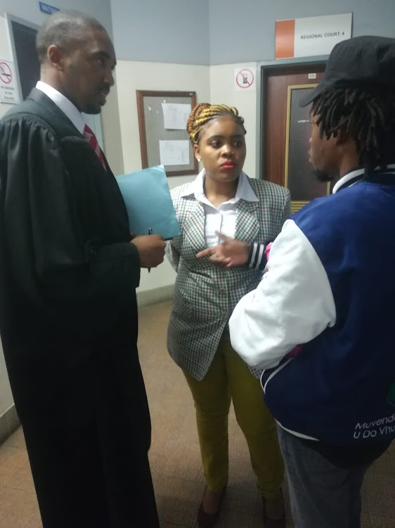 Sibongile Mani gets instructions from her lawyer Asanda Pakade at court in East London on July 2, 2018.