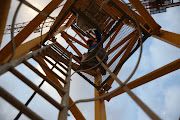 It takes this construction worker about eight minutes to climb the 38m crane to get to work each morning.