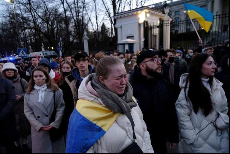 People gather in front of the Russian Embassy to protest against Russia's military operation in Ukraine, in Warsaw, Poland February 24, 2022.