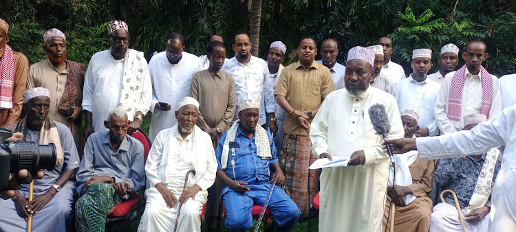 Abdullahi Haji speaking to the press at a Garissa hotel on Friday. They thanked president William Ruto for the appointments.