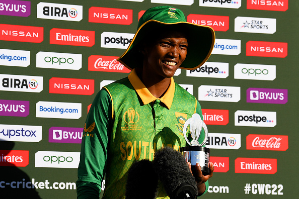 SA bowler Ayabonga Khaka poses with the Player of the Match trophy after the Proteas' victory in their 2022 ICC Women's Cricket World Cup match against Bangladesh.