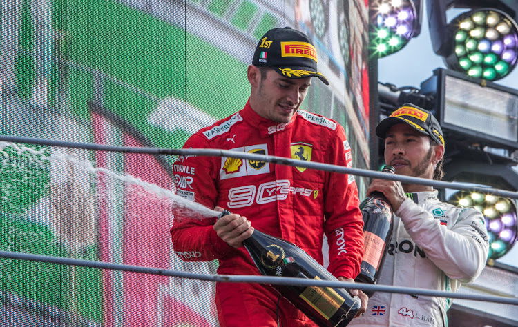 Charles Leclerc, left, celebrates next to third-placed Lewis Hamilton after the Italian Formula One Grand Prix at the Autodromo Nazionale circuit in Monza on September 8 2019.