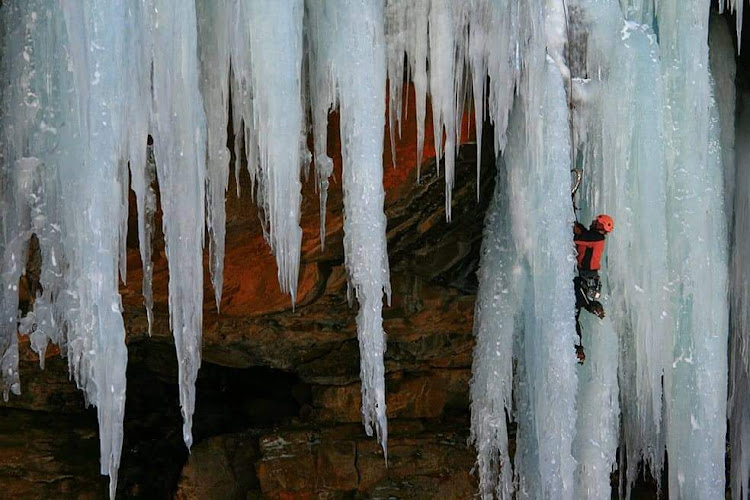 Mountain climbing instructor Gavin Raubenheimer ascends an ice formation at Bokong, Lesotho.