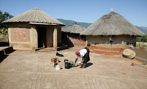 May 25,2016. FEELING THE PAIN: Mmamokoto Maake , 73, cooking at home in GaSekgopo village near Modjadjieskloof, Limpopo. Pic. Sandile Ndlovu. © Sowetan.