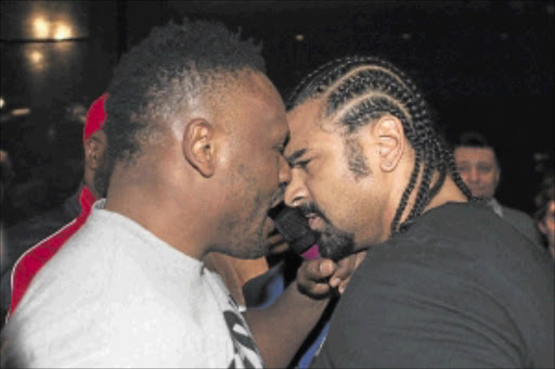 HEAD TO HEAD: David Haye of Britain and compatriot Dereck Chisora confront each other before a brawl during a news conference. PHOTO: REUTERS