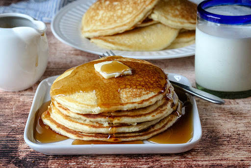 Kathie's Pancakes (Sweetened Condensed Milk) with syrup.