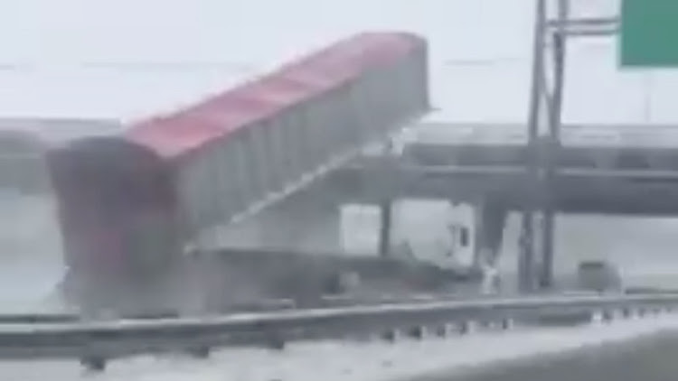 Truck collides with bridge.