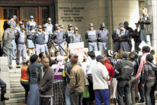 DISGRUNTLED: About 100 residents of Cape Town's Mfuleni township held a protest outside the Western Cape provincial government yesterday calling for houses. PHOTO: Elvis ka Nyelenzi