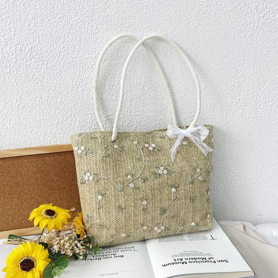 Nova bolsa feminina com laço e tecido trançado. Combina com tudo, ideal para looks diversos e elegantes. Seu acessório perfeito.