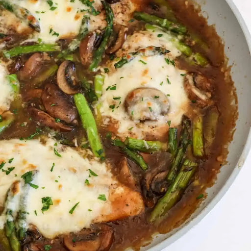 Chicken Madeira combines tender chicken, crisp asparagus, and melty mozzarella cheese in a sweet and savory wine sauce.
