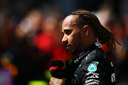 Nelson Piquet apologised to Lewis Hamilton on Wednesday after a video emerged of him using an apparent racial slur in Portuguese when referring to the Mercedes driver.