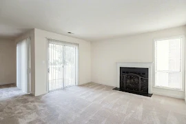 Living area with fireplace and sliding glass door