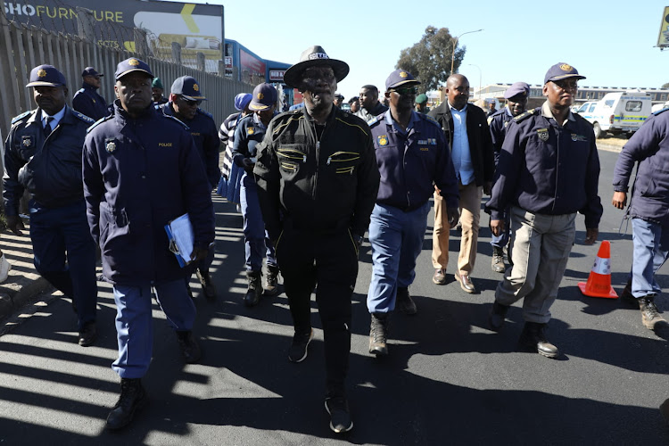 Police minister Bheki Cele doing a walkabout in Riverlea where illegal miners are terrorising community members.