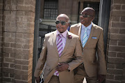 Businessman Kenny Kunene (Left) and Sunday Independent’s editor Steve Motale exit the South Gauteng High Court in the Johannesburg CBD. The pair where taken to court by a woman who was connected to Deputy President Cyril Ramaphosa’s alleged affair. Picture credit: Alaister Russell/The Times