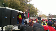 Numsa president Andrew Chirwa addresses workers outside Megawatt Park