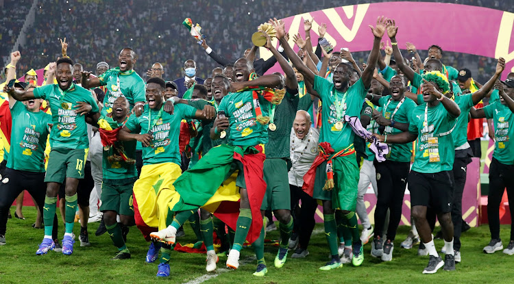 Senegal players celebrate with the trophy after winning the Africa Cup of Nations