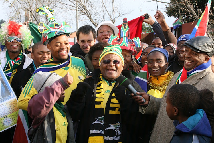 Archbishop Desmond Tutu, with well known sports fans, showing his support for Bafana Bafana at 2010 World Cup the kickoff concert at Orlando Stadium on June 10 2010.