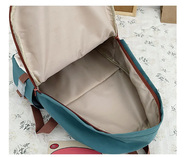 Sac à dos fille grande capacité en nylon, couleurs contrastées, idéal pour l'école, les voyages, robuste et pratique.