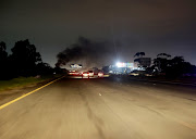 Tyres burn near the old Durban airport in Prospecton during the shutdown. 