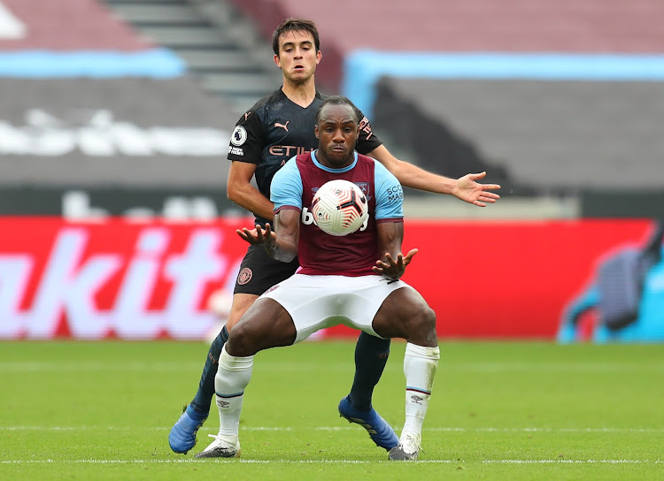 West Ham United's Michail Antonio in action with Manchester City's Eric Garcia