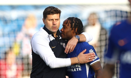 Chelsea manager Mauricio Pochettino and Raheem Sterling celebrate after the Premier League match agianst Burnley at Turf Moor in Burnley on Saturday.