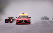 The FIA safety car leads Max Verstappen and the rest of the field at the restart during the F1 Grand Prix of Belgium at Circuit de Spa-Francorchamps on August 29 2021 in Spa.