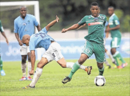 GRITTY: AmaZulu's Khulekani Madondo, right, fights for the ball with Platinum Stars's Solomon Mathe during their Telkom Knockout match at Sugar Ray Xulu Stadium in Durban yesterday. Photo: Gallo Images