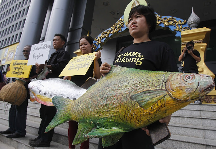 Villagers demonstrate outside Thailand's administrative court in Bangkok.