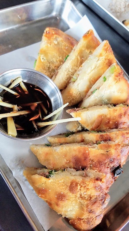 Danwei Canting Spiced Beef Jianbing with the minced beef sandwiched between the flaky dough layers