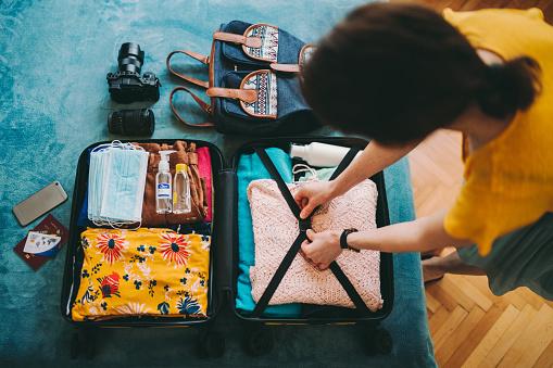 https://media.istockphoto.com/photos/woman-packing-suitcase-for-travel-picture-id1255431817?b=1&k=20&m=1255431817&s=170667a&w=0&h=kER4jneZNFnQnooPIAceVAHVpSyV2G6Q-hMpM3pe5iA=