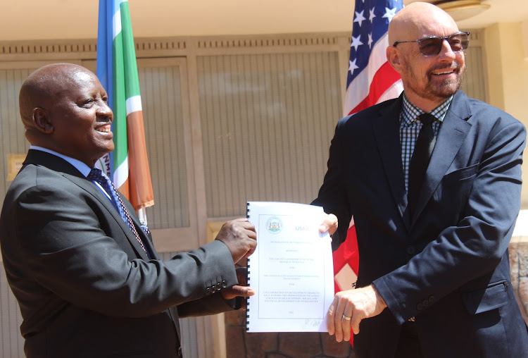 Nyeri Governor Mutahi Kahiga and USAID mission director Mark Meassick after signing an MoU outside the governor’s office in Nyeri on Monday.