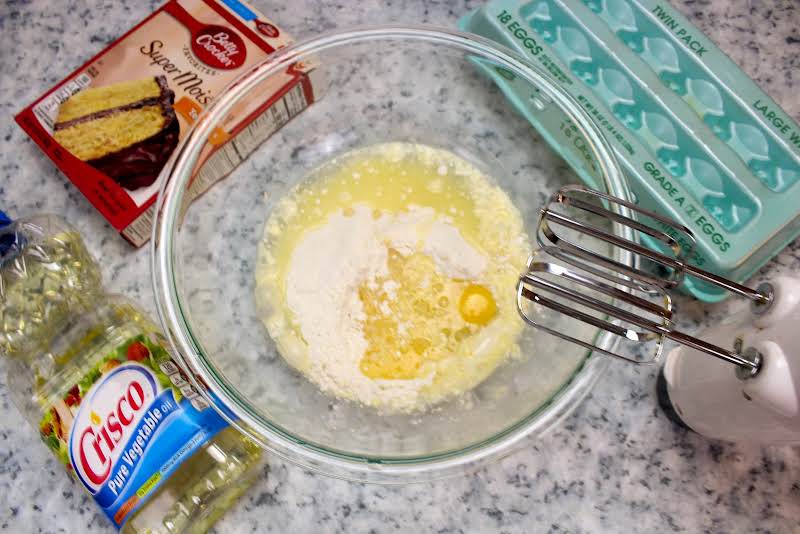 Mixing Yellow Cake Mix Ingredients Together.