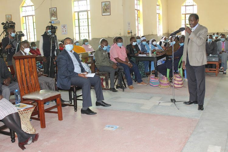 Wiper leader Kalonzo Musyoka addressing a congregation at Kisooni Catholic church in Mumbuni, Machakos County on Sunday, July 4.