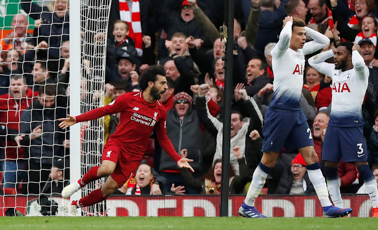 Tottenham's Danny Rose, and Dele Alli look startled as Liverpool's Mohamed Salah celebrates following Toby Alderweireld