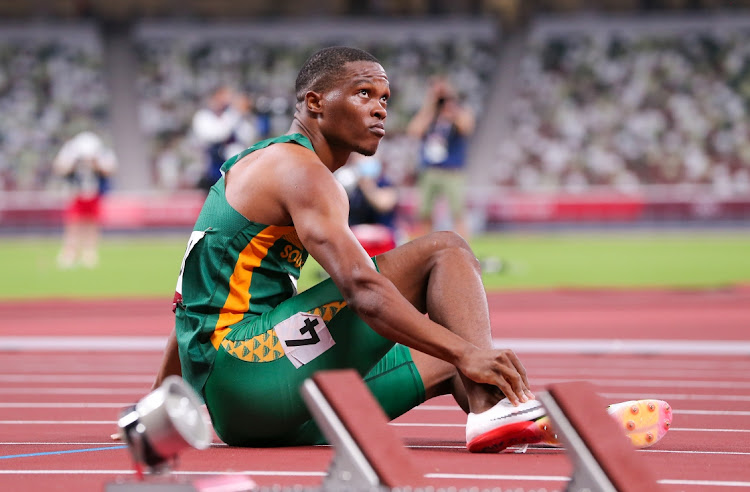 Gift Leotlela lies injured after his semi final in the mens 100m during the evening session of the Athletics event on Day 9 of the Tokyo 2020 Olympic Games at the Olympic Stadium on August 01, 2021 Tokyo, Japan.
