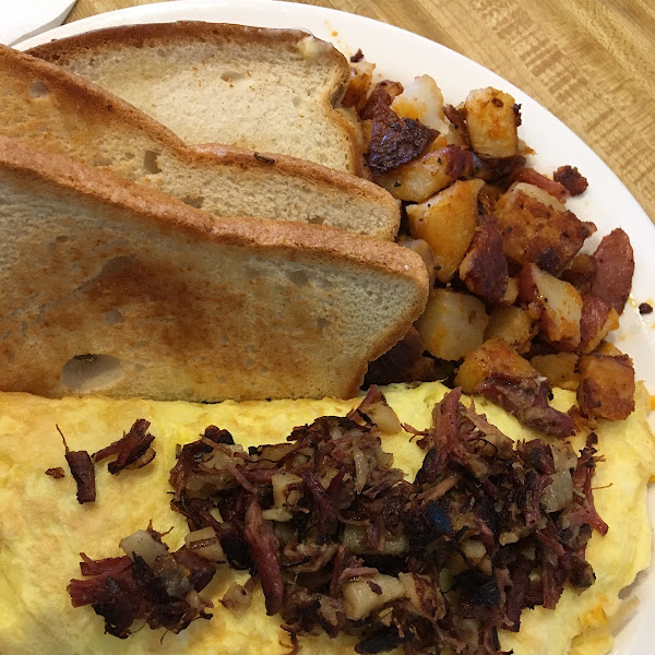 Hash omelette with home fries and toast