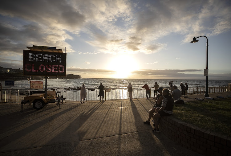 Residents wait for Bronte Beach to be reopened in Sydney, Australia, on Tuesday